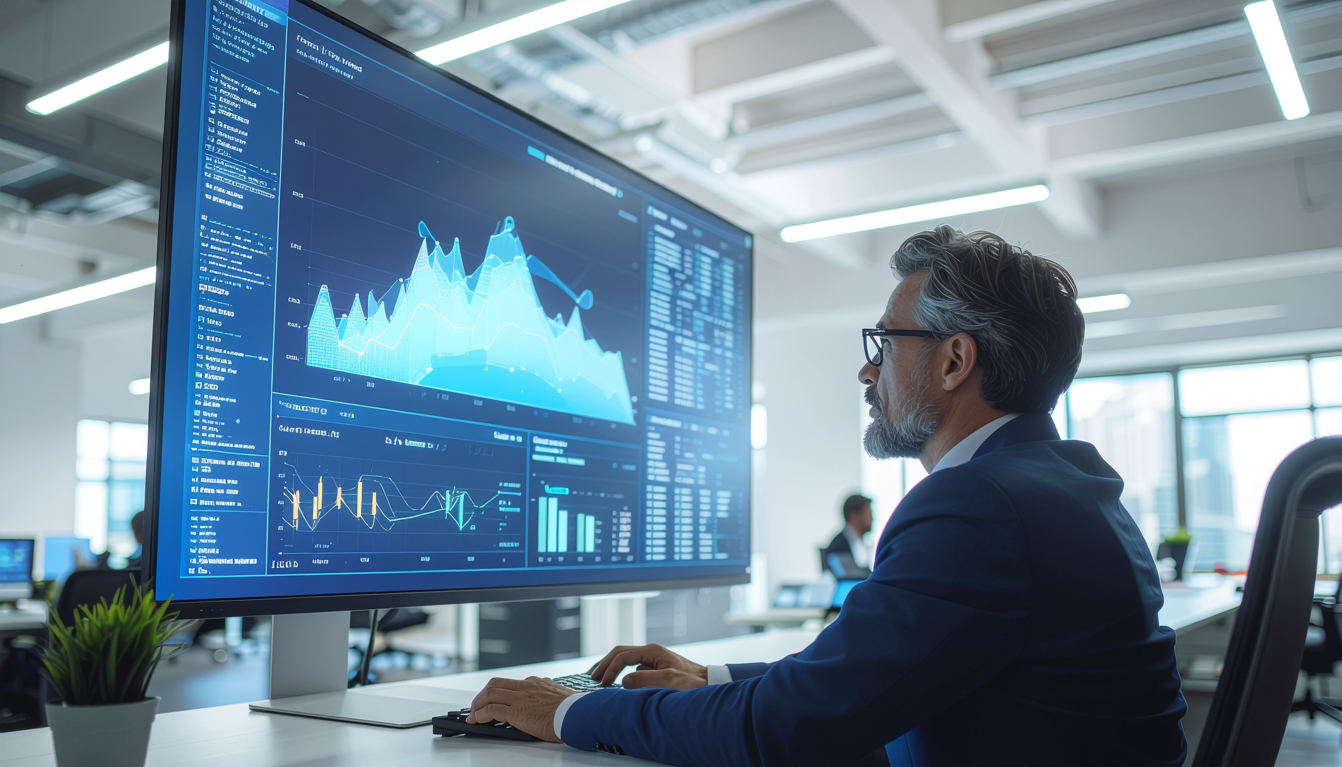 Executive Analyzing Data Charts on Large Monitor in Modern Office